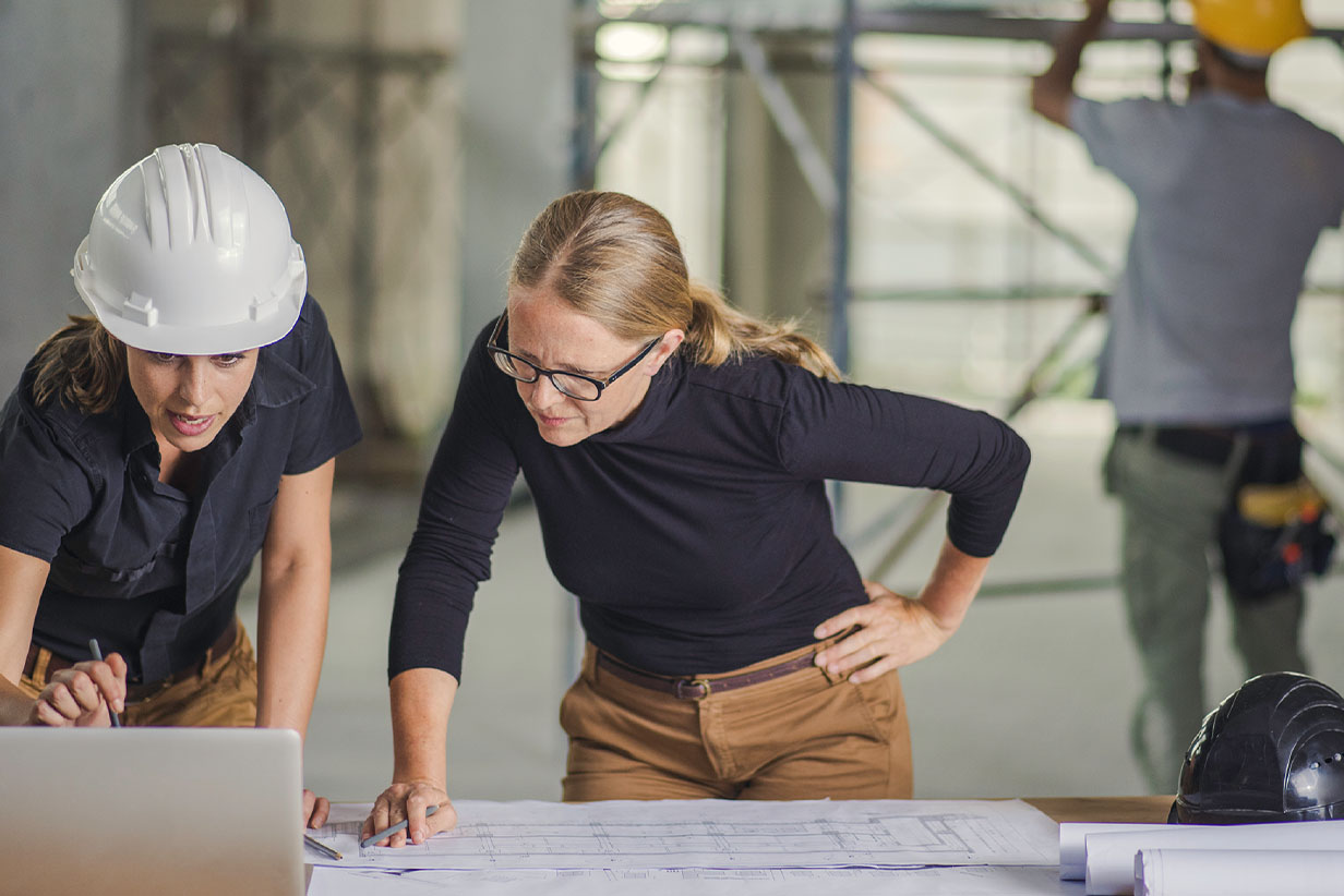 One Fell Swoop - women at building site
